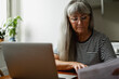 © Johnér - Senior woman using laptop
