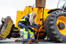 Woman Working With Construction Vehicle