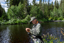 Man Fishing In River