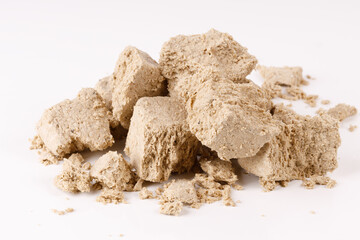 Poster - a bunch of pieces of halva on a white background