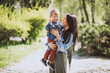 © Petro - Mother with her little son having fun in park