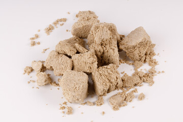 Poster - a large pile of pieces of halva on a white background