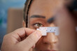© DragonImages - Closeup image of doctor measuring distance between eyes of patient with special ruler to write this information in prescription document