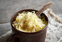 Fermented Cabbage Or Sauerkraut In A Brown Pot