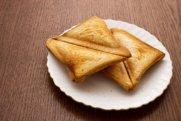 two toasted slices of bread on a white plate