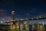 Fototapeta Most - Manhattan Bridge under the full moon night landscape. This amazing constructions is one of the most known landmarks in New York.