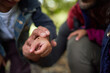 © Trevor Adeline/Caia Image - Close up father and son looking at ladybug on hand