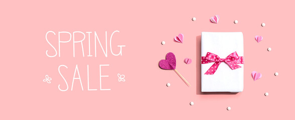 Wall Mural - Spring sale message with a gift box and paper hearts