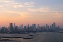 Manama City Skyline At Sunset In The Gulf Country Of Bahrain 