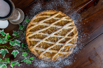 Delicious apple pie on wood table background.