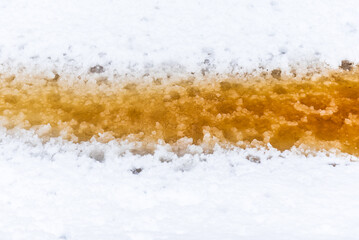 Wall Mural - Forest ditch with yellow-brown water in snowy winter thaw day.