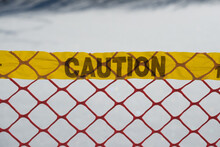 Danger Warning Sign On Fence
