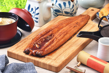 Wall Mural - Grilled eel(grilled unagi) on the wooden cutting board