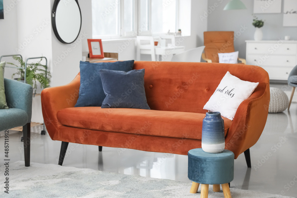 Interior of modern living room with stylish brown sofa