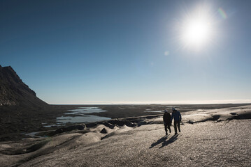 Wall Mural - Tourists walking on Breidamerkurjokull Glacier, Vatnajokull Ice Cap, Iceland, Europe