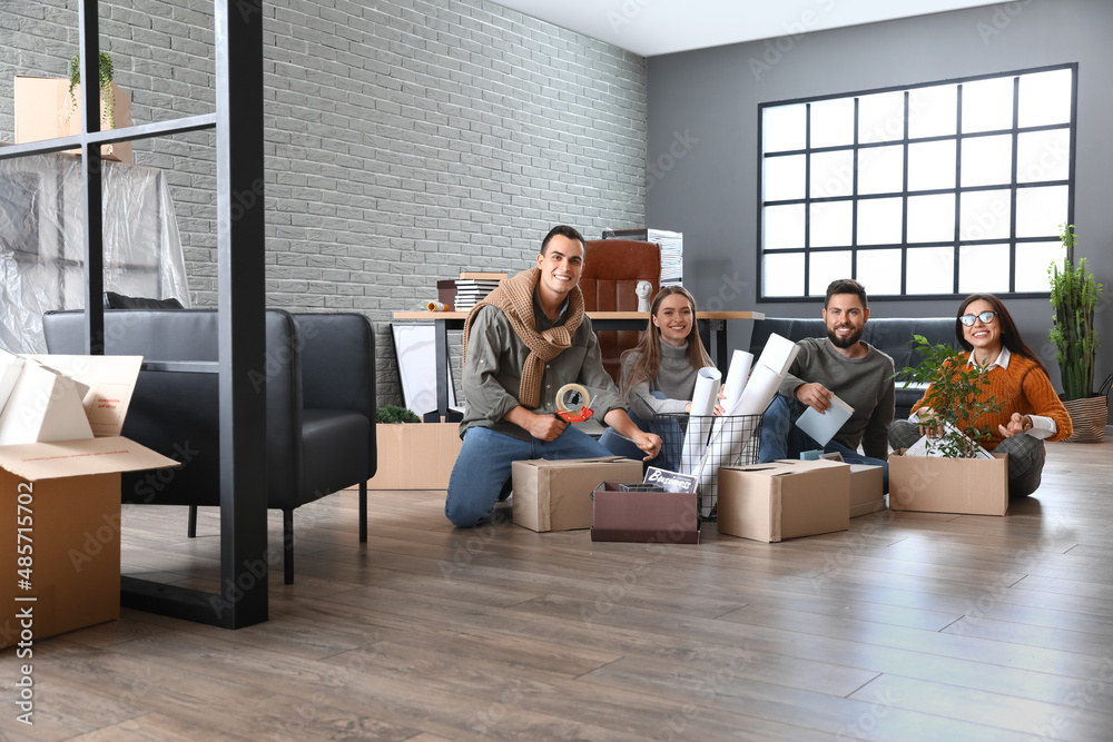 Business people packing stuff in office on moving day