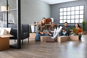 Wall Mural - Business people packing stuff in office on moving day