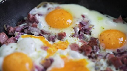 Wall Mural - Eggs scramble with ham on hot pan