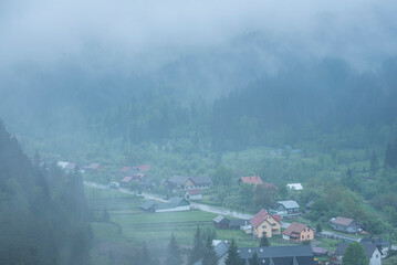 misty romanian forest landscape around sucevita monastery, bukovina region, romania, background with