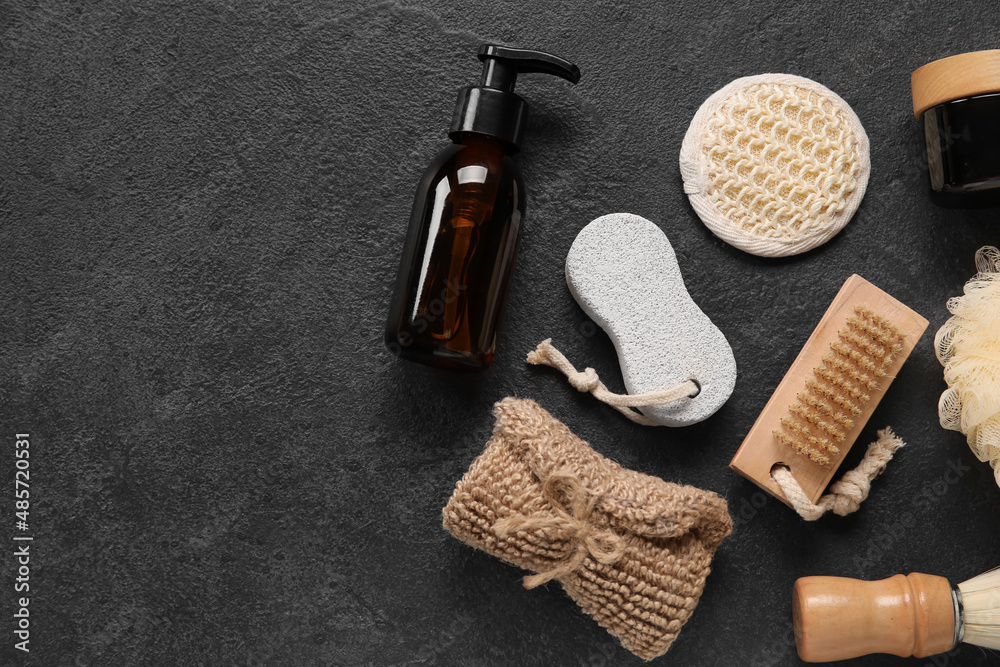Set of different bath supplies and cosmetics on dark background