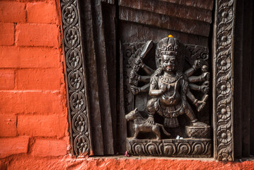 Wooden carving Statue of Hindu God at Nepali Mandir, one of the oldest Hindu temples in Varanasi, Uttar Pradesh, India