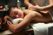 © H_Ko - Relaxed smiling lady enjoy professional massage in spa center, full relaxation