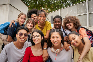 Selfie of a group of students looking at the camera smiling. Happy to be back to school.