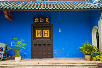 Wall Mural - Bright Blue Walls and Beautiful Doors at Cheong Fatt Tze Mansion in George Town, Penang, Malaysia, Southeast Asia