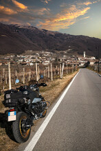 Hilly Landscape In Winter, With The Motorbike On The Road That Passes Through The Vineyards 