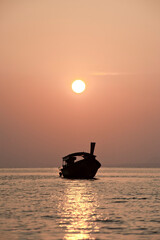 Poster - Traditional Thai Boat Silhouetted at Sunrise at Exotic East Railay Beach, South Thailand, Southeast Asia