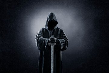 Wall Mural - Warrior with hooded cape and medieval sword over dark misty background