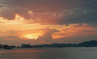 Wall Mural - Beautiful tropical orange sunset at sea in Thailand