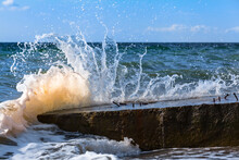 Broken Wave Splash High / Sea Wave Splashing When Hit At Large Stony Concrete Block