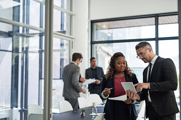 Ironing out the details. Shot of corporate businesspeople meeting in the boardroom.