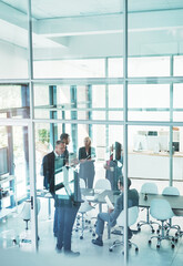 Wall Mural - Looks like their meetings adjourned. Full length shot of a group of corporate businesspeople meeting in the boardroom.