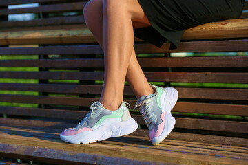 woman's legs wearing sport sneakers outdoors