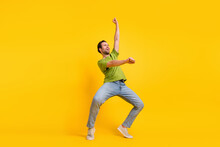Full Size Profile Side Photo Of Young Man Have Fun Ride Horse Look Empty Space Isolated Over Yellow Color Background