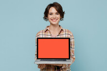 Young Smiling Happy Copywriter Woman 20s Wearing Brown Shirt Hold Use Work On Laptop Pc Computer With Blank Screen Workspace Area Isolated On Pastel Plain Light Blue Color Background Studio Portrait