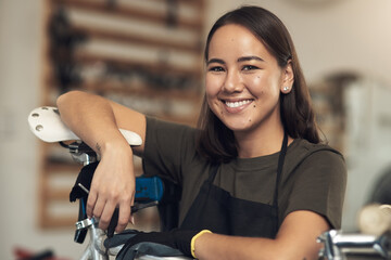 Aufkleber - Want to see what we have in stock. Shot of an attractive young woman standing alone in her bicycle shop during the day.