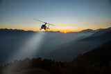 Fototapeta Tęcza - helicopter with lighthouse in night flight in the high mountains