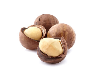 Wall Mural - Macadamia nuts in closeup isolated on white background.