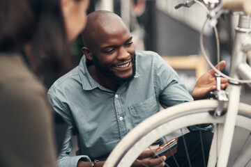 Aufkleber - This is exactly what Ive been looking for. Shot of a handsome young man crouching down and looking at a bicycle before buying it.