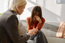 Emotional Young Woman Patient Talking To Psychologist