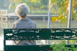 © amazing studio - Asian elderly woman depressed and sad sitting back on bench in autumn park.