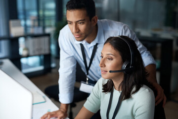 Aufkleber - First day in the customer service field. Shot of a young man and woman using a computer while working in a call centre.