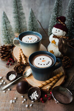 Mugs Of Hot Cocoa With Marshmallows Surrounded By Winter Things.