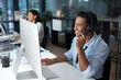 © Nicholas Felix/peopleimages.com - Understanding starts with listening. Shot of a young man using a headset and computer in a modern office.