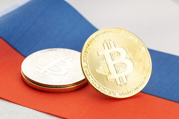 Bitcoin cryptocurrency coins on national flag of Russia. Crypto law regulation concept