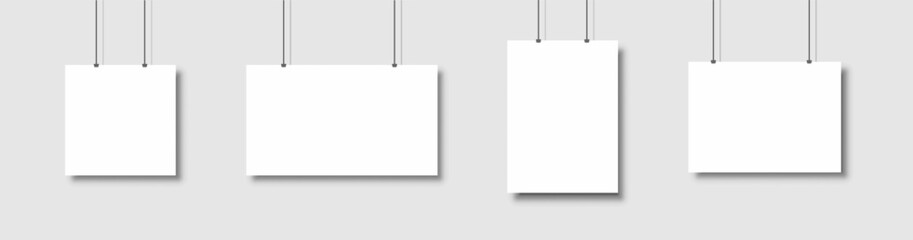 Poster - Template of white blank vector posters. Set of mockups hanging on the wall. Frame for paper sheet. Isolated on gray background. Vector illustration