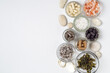 Dietary supplements in capsules, white, gray, pink crystals of salt, algae, in glass jars